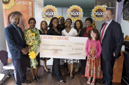 Dona Croll and Randolph Gray present £10,000 to 2009 winners, Shern Hall Youth Steel Band
